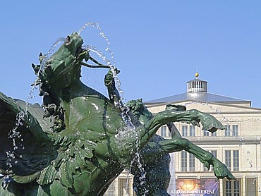 The fountain Mendebrunnen at the place Augustusplatz, in the background the opera house, Leipzig, Saxony, Germany