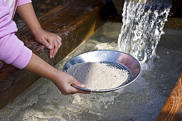 Teenagers "searching for gold", washing sand at Legoland, Guenzburg, Bavaria, Germany