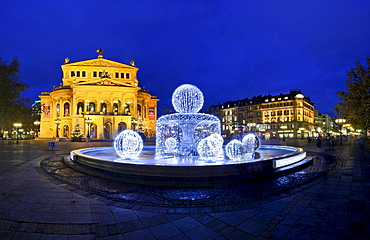 Alte Oper (Old Opera) with special christmas illumination of the fountain, Frankfurt, Hesse, Germany