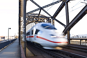 ICE (InterCityExpress) German high-speed train driving over a bridge fast, Hesse, Germany, Europe