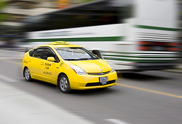 Taxi, Yellow Cab, in motion, Vancouver, British Columbia, Canada, North America