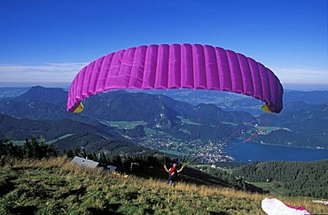 Paraglider Zwolferhorn mountain Wolfgangsee St. Gilgen Salzkammergut Austria