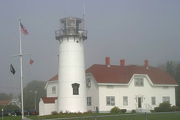 Chatam light is emerging from fog. Cape Cod, Massachusetts, USA