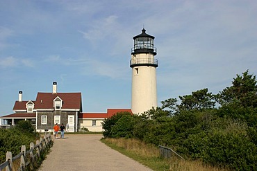 Highland Light (Cape Cod Light). The station was established in 1797, the present buildings date from 1857. At that time, the lighthouse was still 150m away from the 40m cliffs, but continuing erosion imperiled the location. At the end of the 20th century