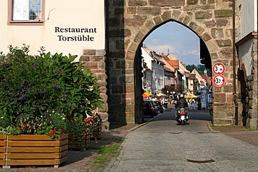 A motor scooter drives through one of the town gates to historic Villingen, Villingen-Schwenningen, Baden-Wurttemberg, Germany