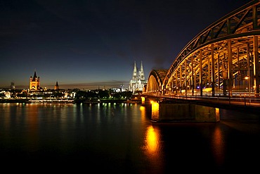 Cathedral, Hohenzollern bridge and St. Martin church seen from the right Rhine river bank, Cologne, NRW, Germany