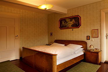 1950s bedroom with nightstands and a religious picture hanging over the bed, Lauf an der Pegnitz, Middle Franconia, Bavaria, Germany, Europe