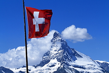 Swiss flag in front of the Matterhorn, Zermatt, Valais, Switzerland, Europe