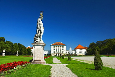 Sculpture of Hades, with Kerberos or Cerberus at his feet, in front of Nymphenburg Palace, Munich, Bavaria, Germany, Europe