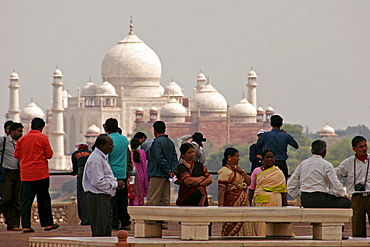 Indian tourists visiting the Red Fort of Agra, with the Taj Mahal in the background, Agra, Uttar Pradesh, India, Asia