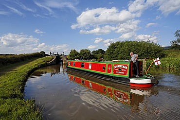 Boat in chanal in front of lock, Cheshire, England