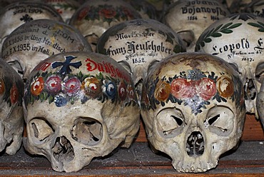 Painted skulls in the ossuary of Hallstatt, Salzkammergut, Upper Austria, Austria