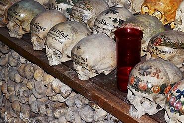 Painted skulls in the ossuary of Hallstatt, Salzkammergut, Upper Austria, Austria