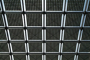 Glass roof of the station hall with solar cells in the new Berlin main station, Germany.