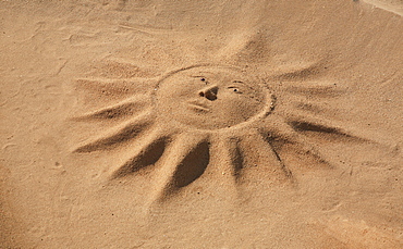 Sun made of sand, Algarve, Portugal