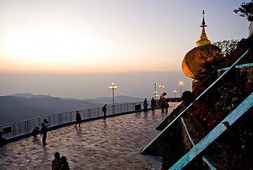 Golden rock and stupa at sunset, Kyaikhtiyo, Myanmar (Burma), Southeast Asia