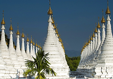 Lots of golden-tipped white stupas in three rows, Mandalay, Myanmar (Burma), Southeast Asia