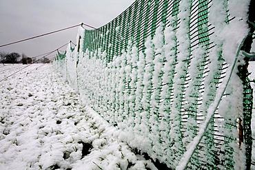 Snow covered fence