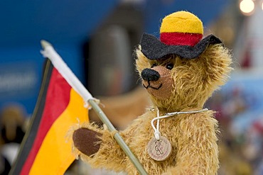 Munich, GER, 01. July 2006 - Teddybear with german flag and a black-red-gold coloured hat