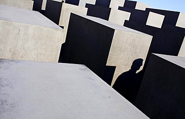 Light and shadows between the concrete slabs of the Holocaust Memorial (Memorial to the Murdered Jews of Europe) in Berlin, Germany