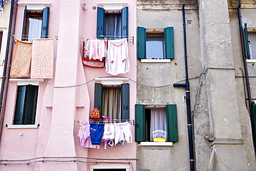 Washing lines on a house wall, Chioggia, Venetian Lagoon, Italy, Europe