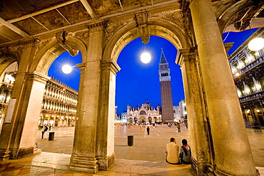 View through arcades towards Basilica di San Marco, St. Mark's Basilica and Campanile, evening mood, Venezia, Venice, Italy, Europe