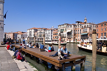 People sitting in the sun on Canal Grande, Grand Canal, Venezia, Venice, Italy, Europe