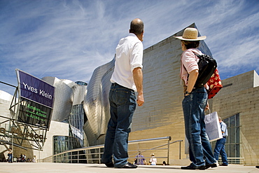 Visitors standing in front of Guggenheim Museum, Bilbao, Basque Country, Spain, Europe