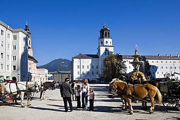 Residenzplatz Square and Residenzbrunnen Fountain, Michaeliskirche Church and the new building of the residency with chime of bells, Salzburg, Europa