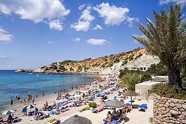 Tourists on a beach, Cala dÂ¥Hort, Ibiza, Balearic Islands, Spain, Europe