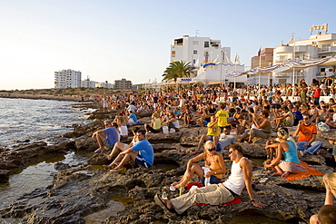 People watching the sunset in front of the Cafe del Mar, Sant Antoni de Portmany, Ibiza, Balearic Islands, Spain, Europe