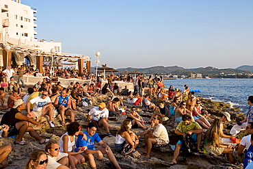 People watching the sunset in front of the Cafe del Mar, Sant Antoni de Portmany, Ibiza, Balearic Islands, Spain, Europe