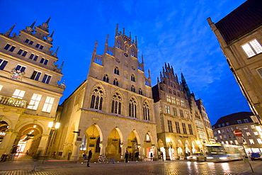 Lit-up city hall and Stadtweinhaus or City Wine House at Prinzipalmarkt, Muenster, North Rhine-Westphalia, Germany, Europe