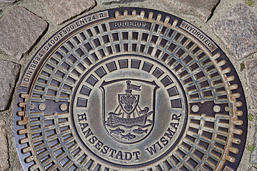 Coat of arms of Wismar on a manhole cover, Wismar, Mecklenburg-Western Pomerania, Germany, Europe