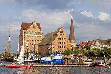 St. Peter's Church and warehouses on the Warnow River, Rostock, Mecklenburg-Western Pomerania, Germany, Europe