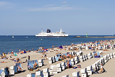 Scandanavian Ferry seen from the beach with roofed wicker beach chairs, Warnemuende, Rostock, Mecklenburg-Western Pomerania, Germany, Europe