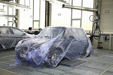 Garage: BMW Mini covered by tarpaulin