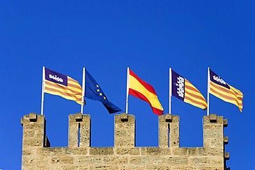 Majorca, Alcudia, flags on the top of a city gate