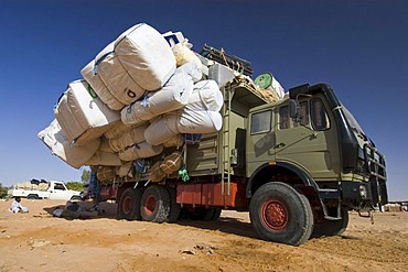 Totally overloaded truck at the oasis of Kufra, Kufrah, Al Kufrah