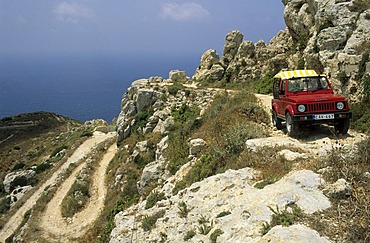 Small fourwheeldrive vehicle on a dirt road at Il-Fawwara, Malta