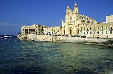 Historic church at a bay in St. Julians, Malta Island, Malta