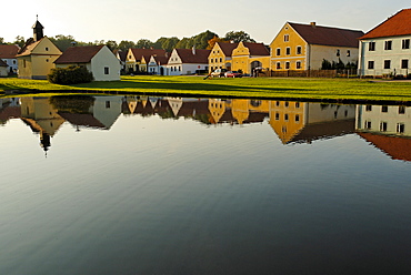 Village square with fire pond of Zabori, south Bohemia, Czech Republic