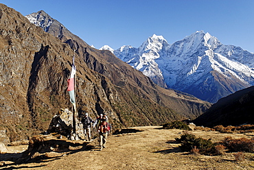 Trekking group at Dudh Koshi valley with Thamserku (6608), Sagarmatha National Park, Khumbu, Nepal