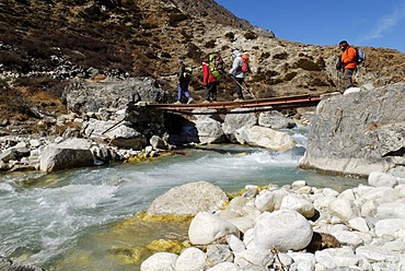 Trekking group on a bridge at Lobuche Khola valley, Sagarmatha National Park, Khumbu Himal, Nepal