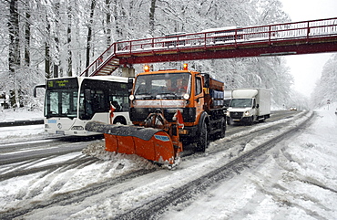 Snow plow clearing Highway B327 after a winter blizzard between Koblenz and Waldesch, Rhineland-Palatinate, Germany