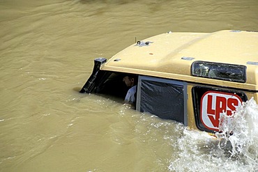 Offroad vehicle is sinking into deep water