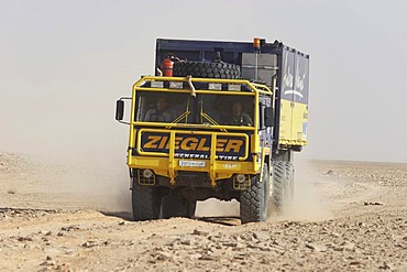 MAN rallye truck on dusty road