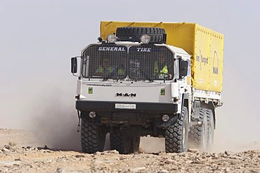 MAN rallye truck on dusty road