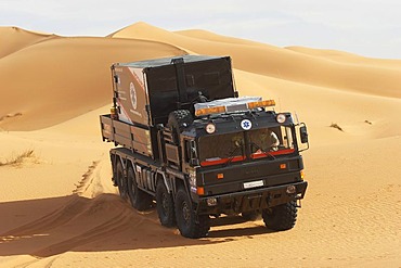 MAN truck with a emergency box on top in the dunes, Lybia