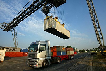 A crane loading container on a truck. Koblenz, Rhineland-Palatinate, Germany